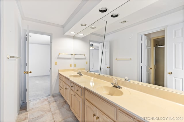 bathroom featuring vanity, ceiling fan, and crown molding