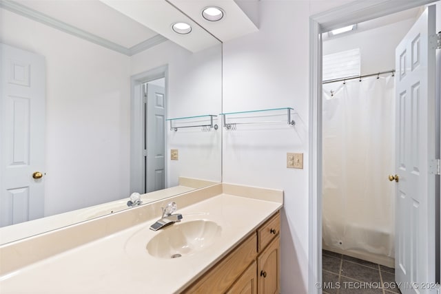 bathroom featuring ornamental molding, vanity, shower / bath combo, and tile patterned floors