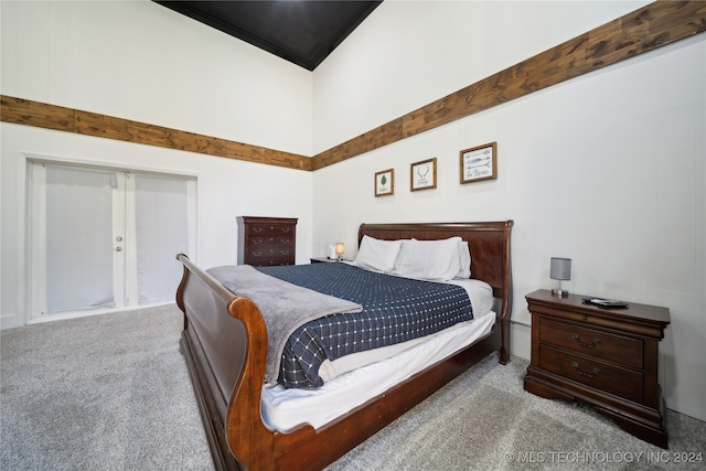 bedroom featuring light carpet