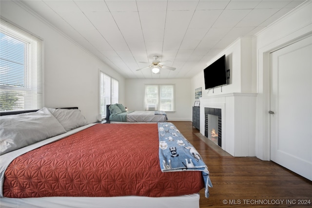 bedroom featuring dark hardwood / wood-style flooring and ceiling fan