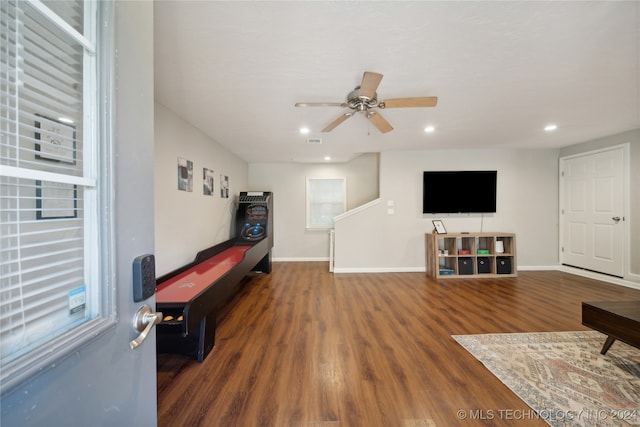 interior space with dark wood-type flooring and ceiling fan