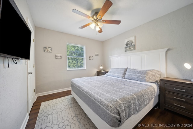 bedroom featuring dark wood-type flooring and ceiling fan