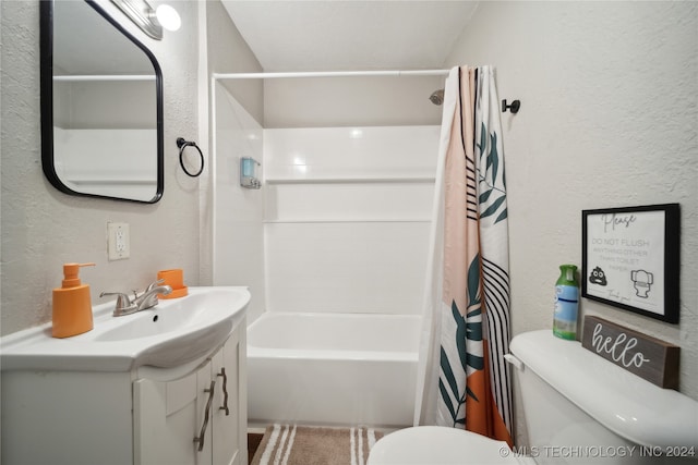 full bathroom with toilet, vanity, and shower / bath combo with shower curtain