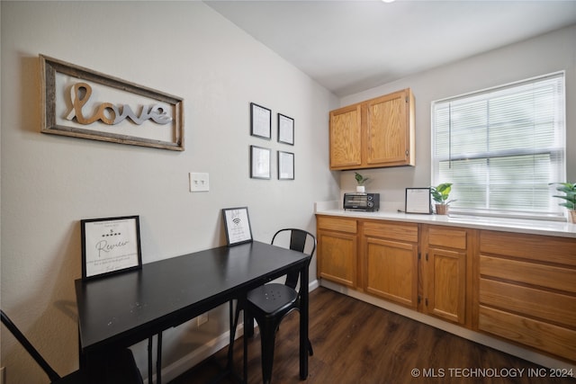 dining space featuring dark hardwood / wood-style floors