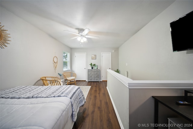 bedroom with dark wood-type flooring and ceiling fan