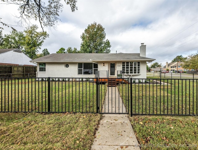 ranch-style house featuring a front lawn