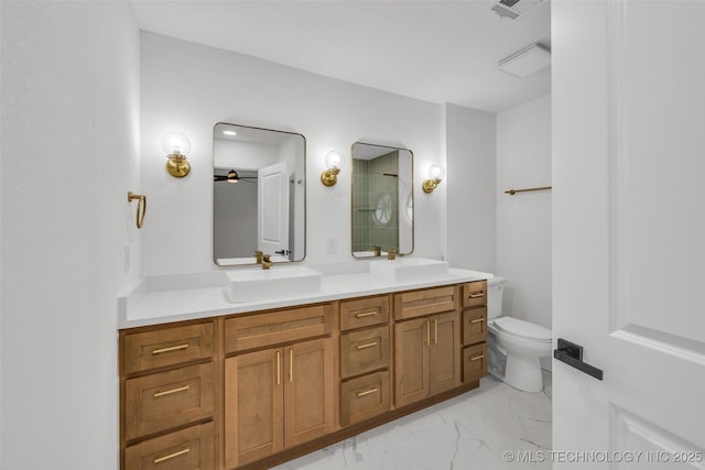 full bathroom featuring toilet, marble finish floor, visible vents, and a sink