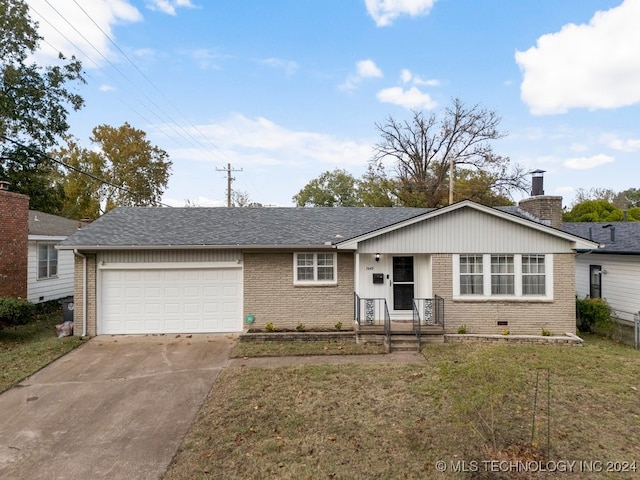 ranch-style home with a front lawn and a garage