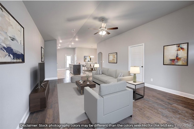 living room with dark wood-type flooring, ceiling fan, and lofted ceiling