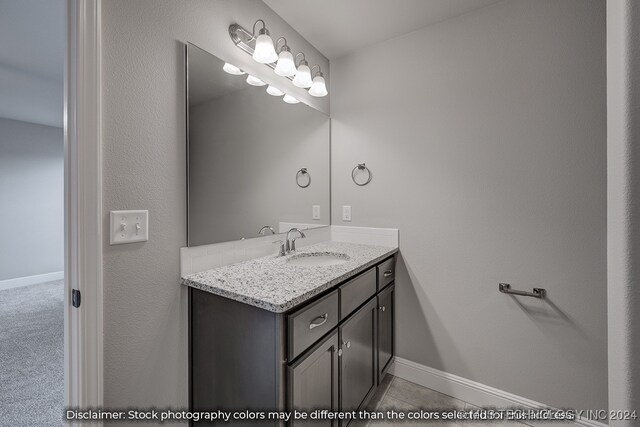 bathroom featuring vanity and tile patterned flooring