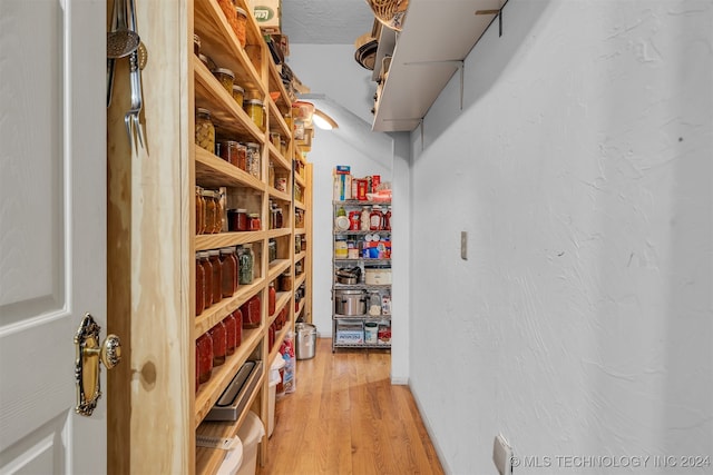 wine area with hardwood / wood-style floors