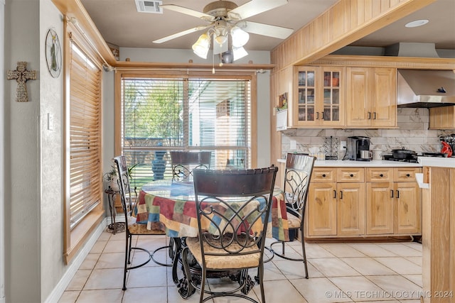 dining area with light tile patterned flooring and ceiling fan