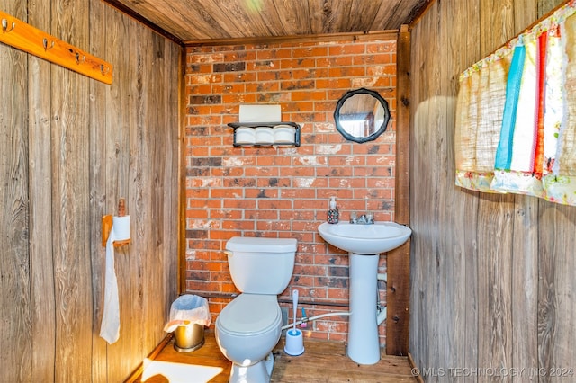 bathroom with wood walls, hardwood / wood-style flooring, toilet, and wood ceiling