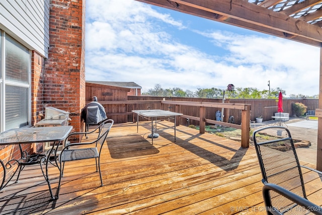 wooden deck featuring a pergola