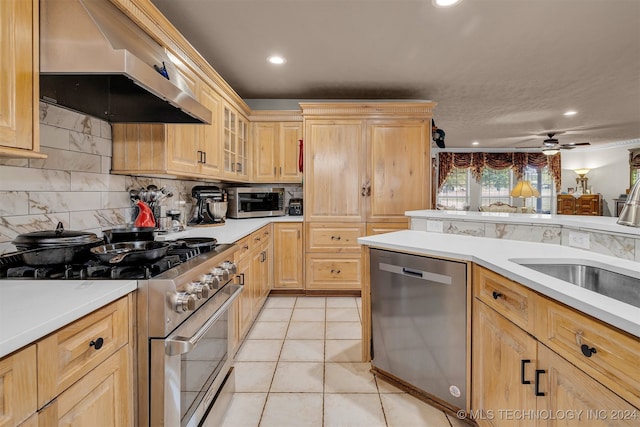 kitchen featuring stainless steel appliances, light tile patterned floors, ceiling fan, extractor fan, and light brown cabinetry