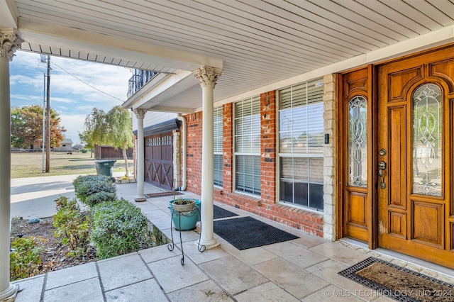 entrance to property with covered porch