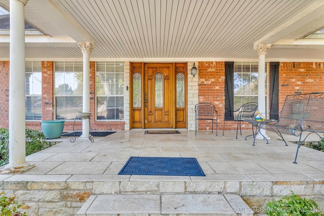 doorway to property featuring a porch