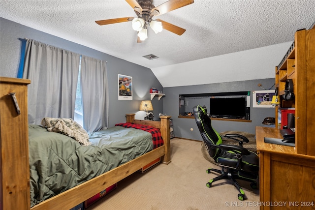 carpeted bedroom with lofted ceiling, a textured ceiling, and ceiling fan