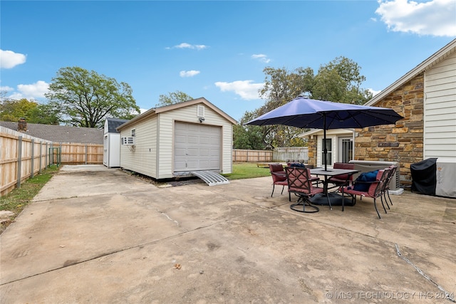 view of patio / terrace with an outbuilding