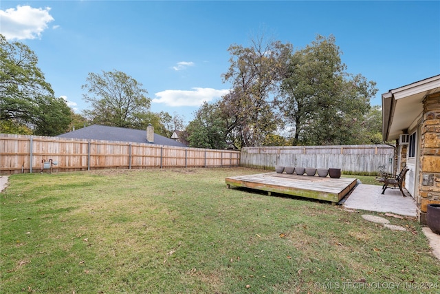 view of yard with a deck