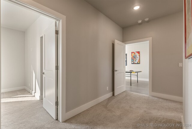 hallway with light carpet