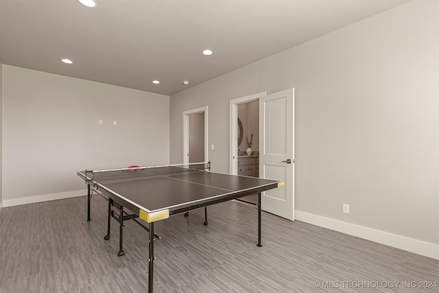 game room with light hardwood / wood-style floors