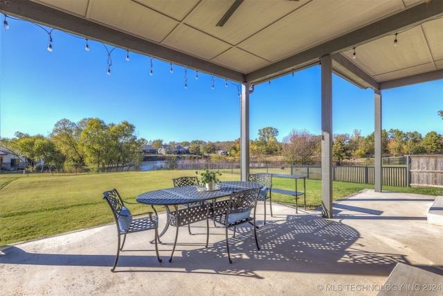 view of patio with a water view