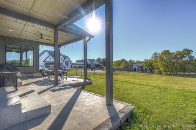 view of patio featuring ceiling fan and grilling area