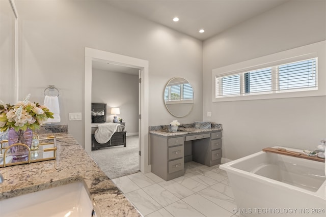 bathroom with vanity and a bathtub