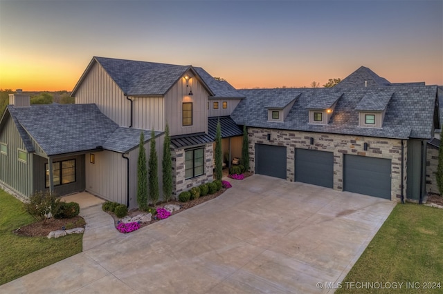 modern inspired farmhouse featuring a garage