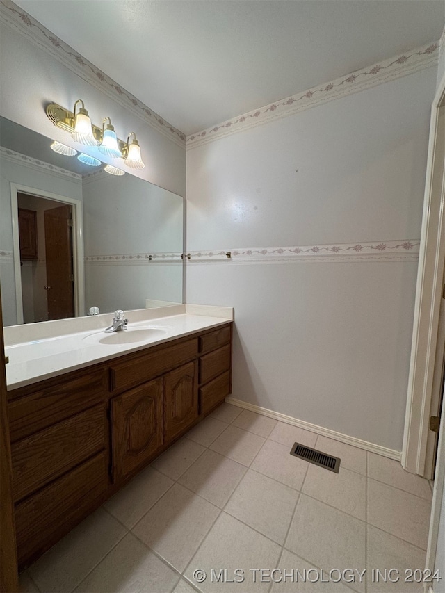 bathroom with vanity and tile patterned floors