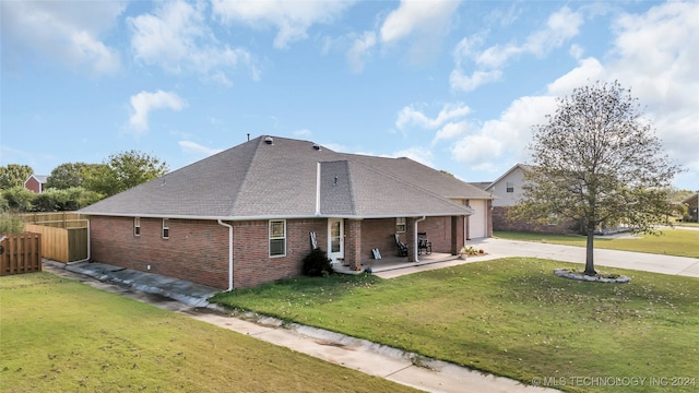 exterior space with a garage and a front lawn