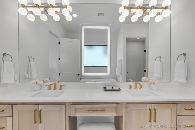 bathroom featuring vanity and a shower with shower door