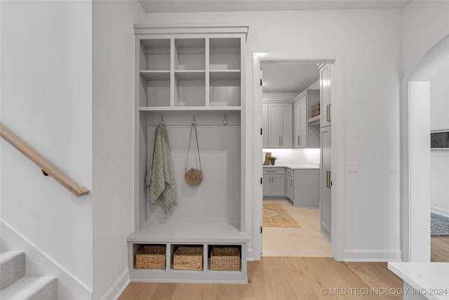 mudroom with light hardwood / wood-style floors