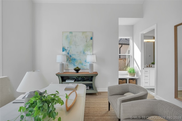 sitting room with light hardwood / wood-style floors