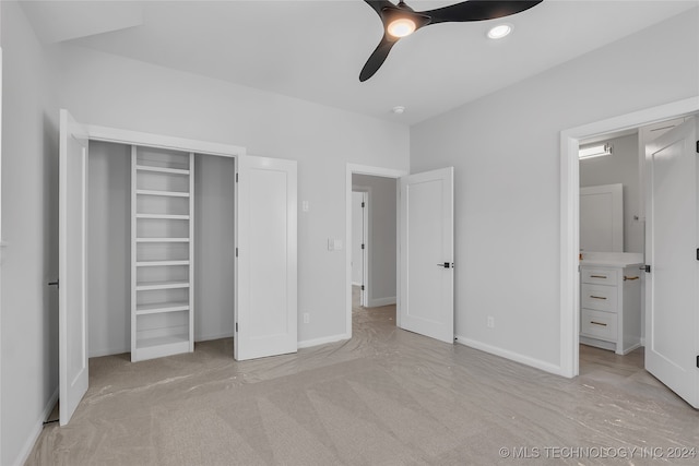 unfurnished bedroom with a closet, light carpet, and ceiling fan