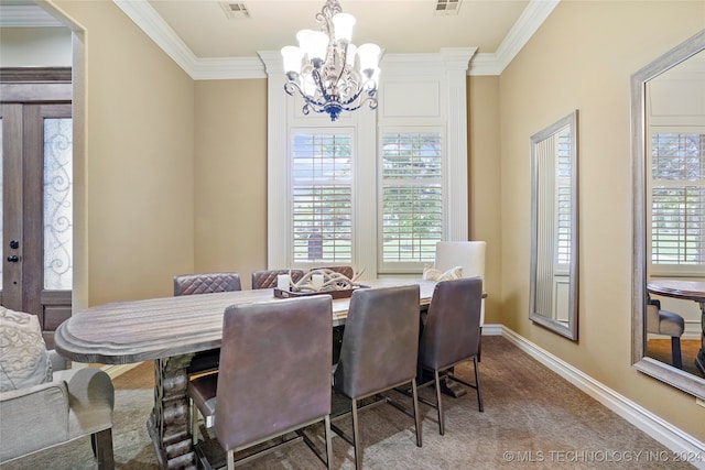 dining space featuring ornamental molding, carpet floors, and plenty of natural light