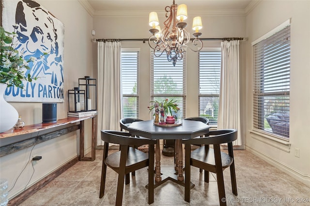 dining space with crown molding and a notable chandelier