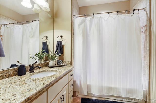 bathroom featuring vanity and a shower with curtain