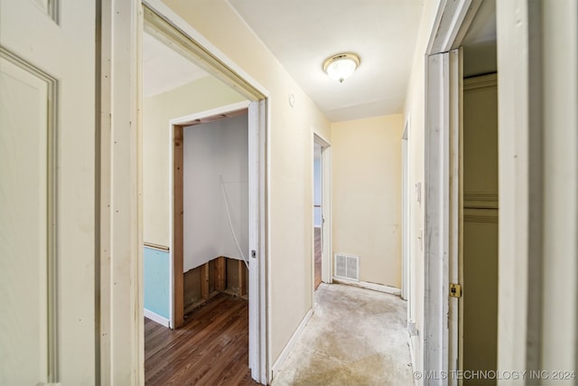 corridor featuring hardwood / wood-style floors