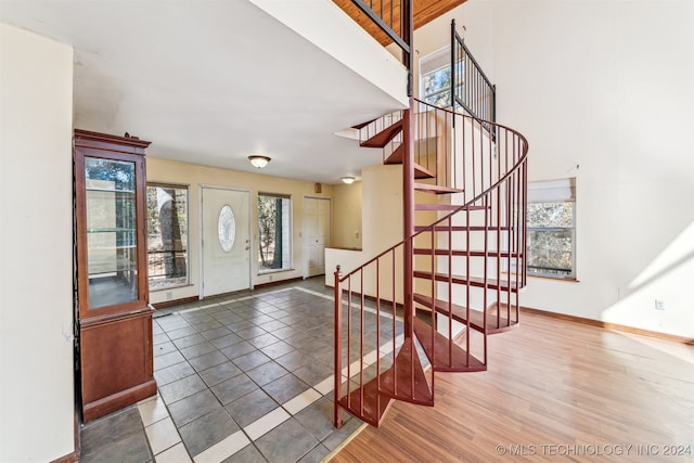 entryway with hardwood / wood-style flooring