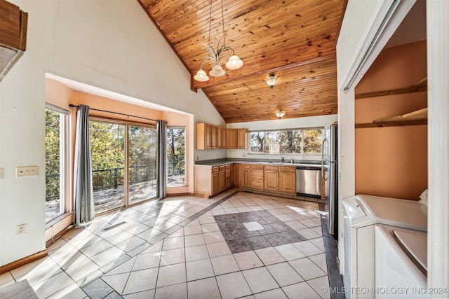 kitchen featuring separate washer and dryer, sink, high vaulted ceiling, light tile patterned flooring, and decorative light fixtures