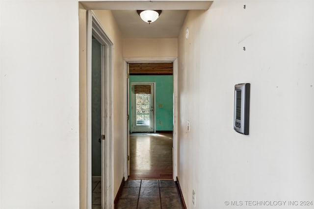 hallway with dark hardwood / wood-style flooring