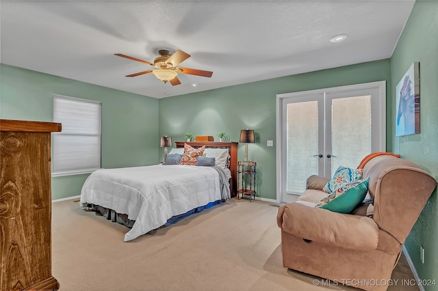 bedroom with multiple windows, carpet flooring, ceiling fan, and access to exterior