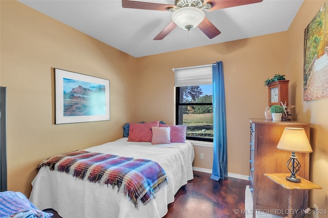 bedroom with ceiling fan and dark hardwood / wood-style flooring