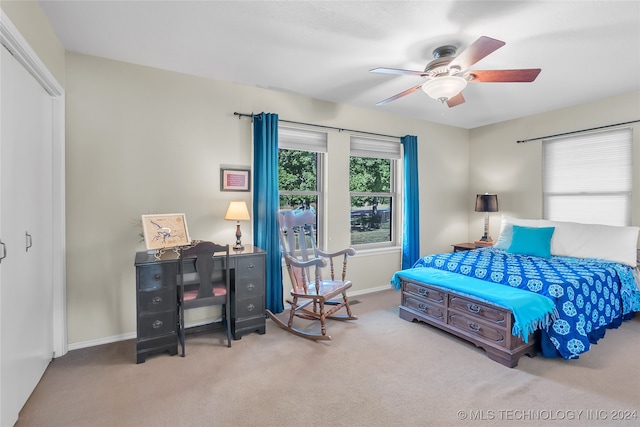 carpeted bedroom featuring ceiling fan