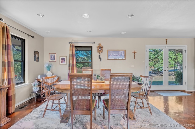 tiled dining room featuring french doors