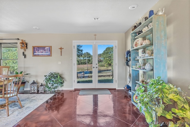 doorway to outside with a wealth of natural light and french doors