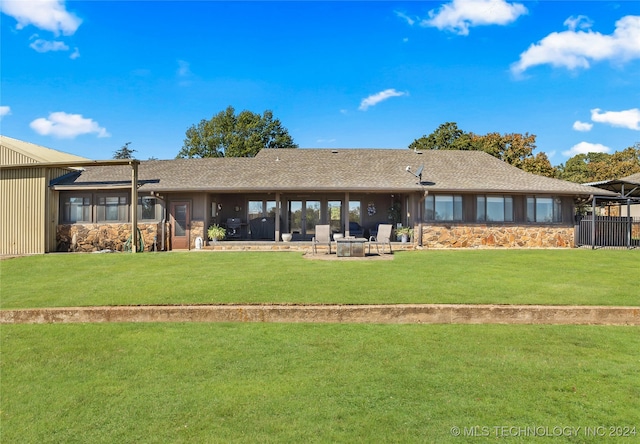 back of house with a patio and a yard