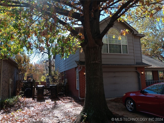 view of side of property with a garage